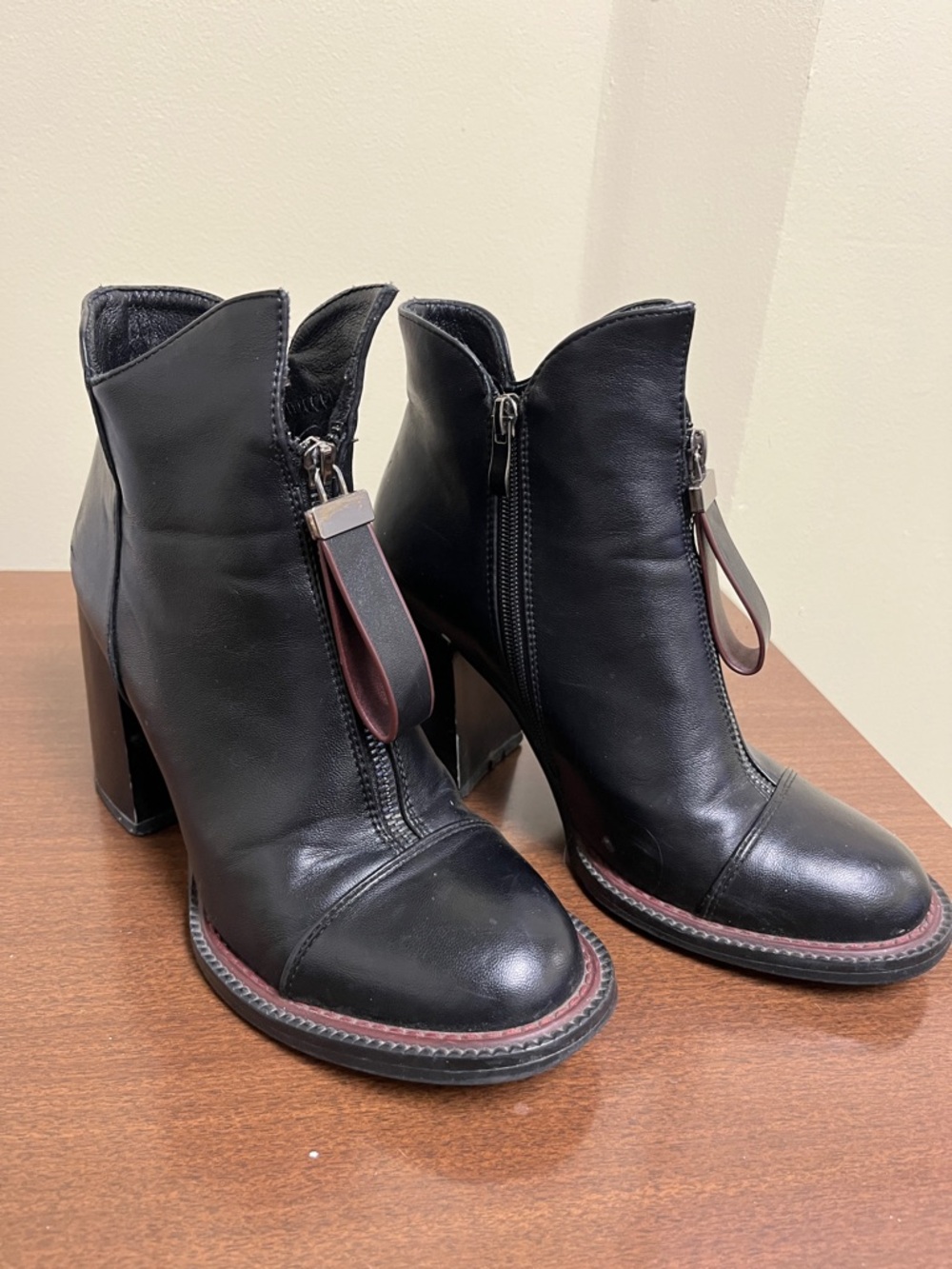 Torgeis Davina Booties a front-zip closure with a distinct leather tab